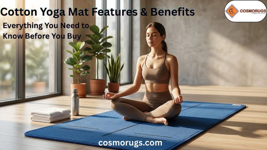 Woman meditating on a handcrafted Cosmorugs cotton yoga mat in a bright modern yoga studio with natural sunlight.