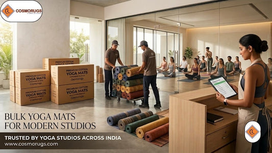 Modern yoga studio with premium handmade cotton yoga mats arranged for a group class, showcasing bulk yoga mat solutions for studio owners by Cosmorugs.